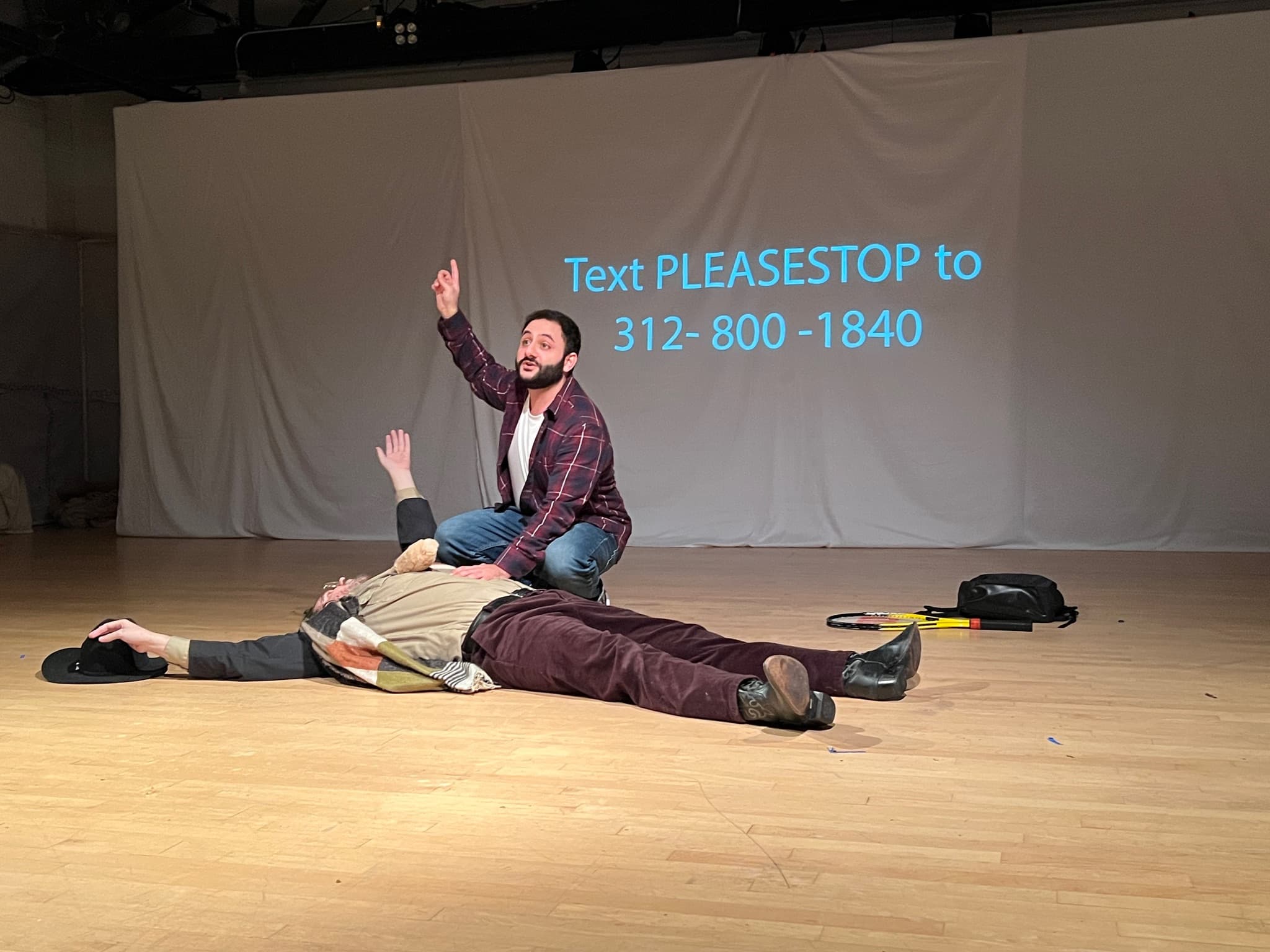 an influence stands over a downed man giving what seems to be a psa style speech, a number on screen allows the audience to text it and save a beast